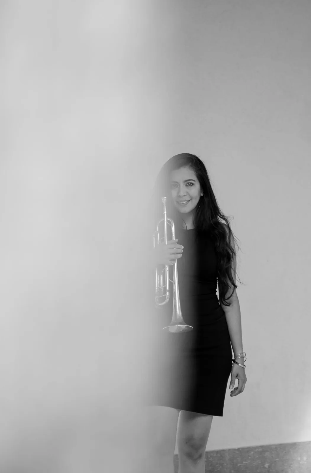 Maria Valencia playing trumpet during a performance